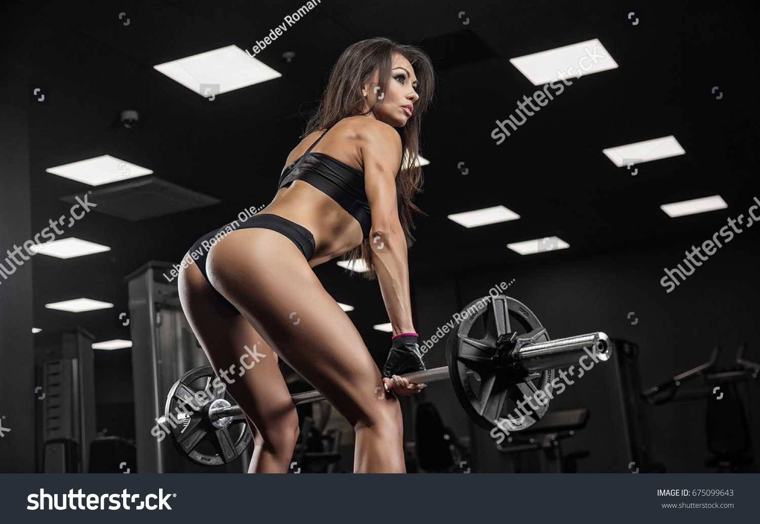 stock photo fitness girl exercising with barbell in gym 675099643