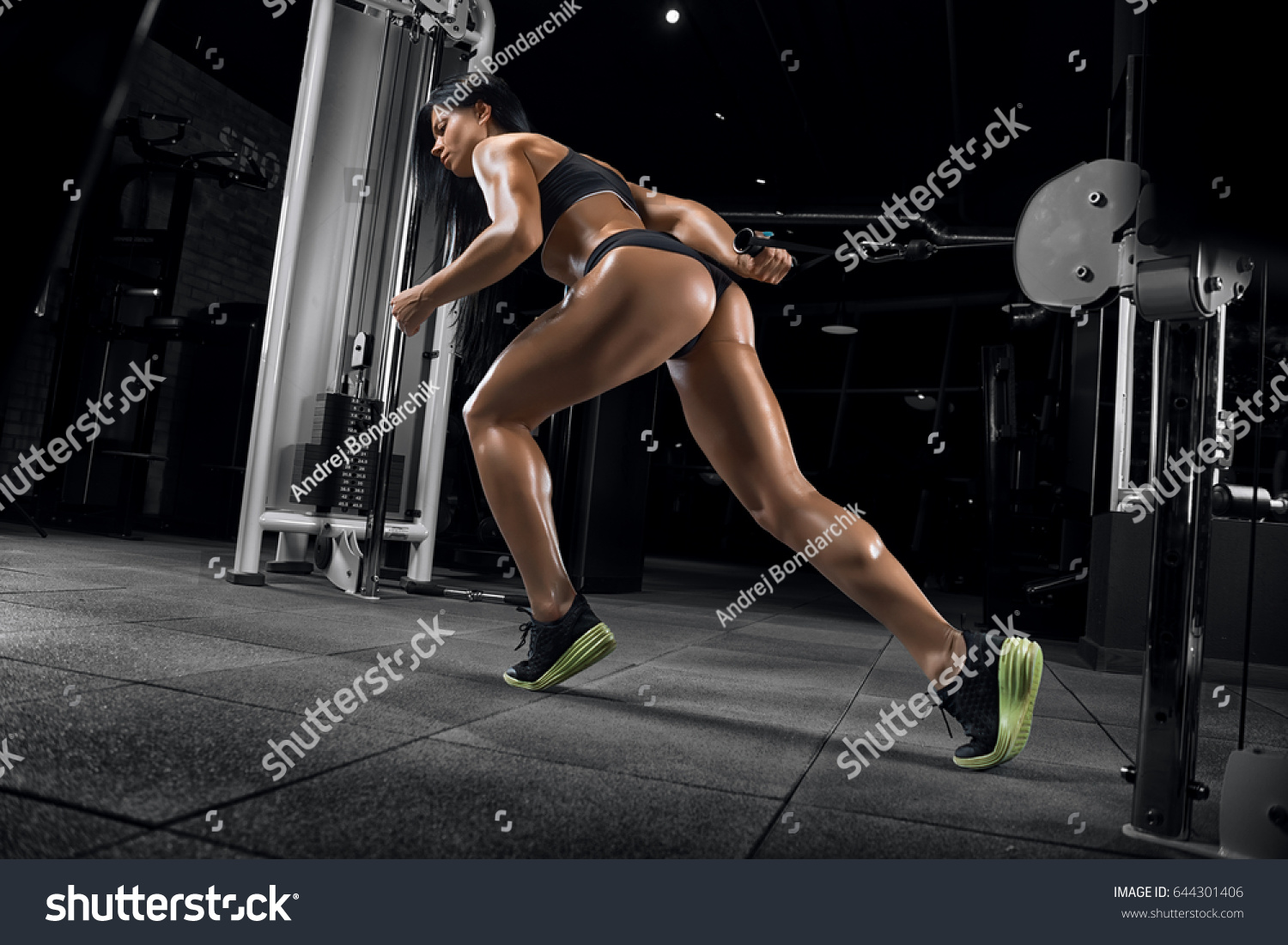 stock photo young beautiful fitness girl posing in gym with sports equipment 644301406